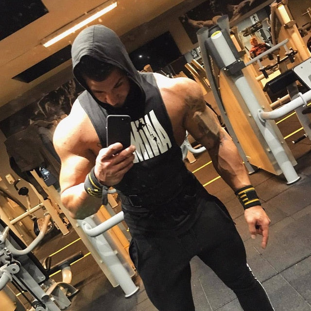 Bodybuilder in a Hood in the Gym